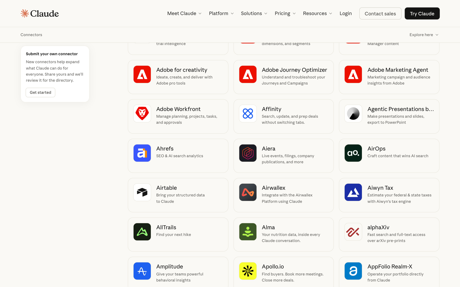 Claude connectors directory showing cards for Adobe, Ahrefs, Airtable, Amplitude, Apollo.io, Airwallex and more, with a submit-your-own option