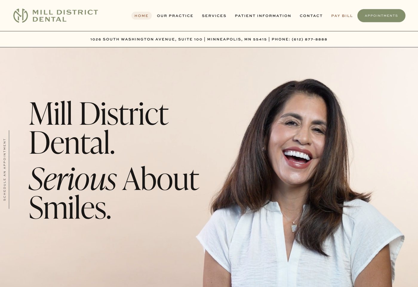 Mill District Dental homepage with the headline Serious About Smiles beside a laughing woman in a white top, and the phone number as plain text in the address bar