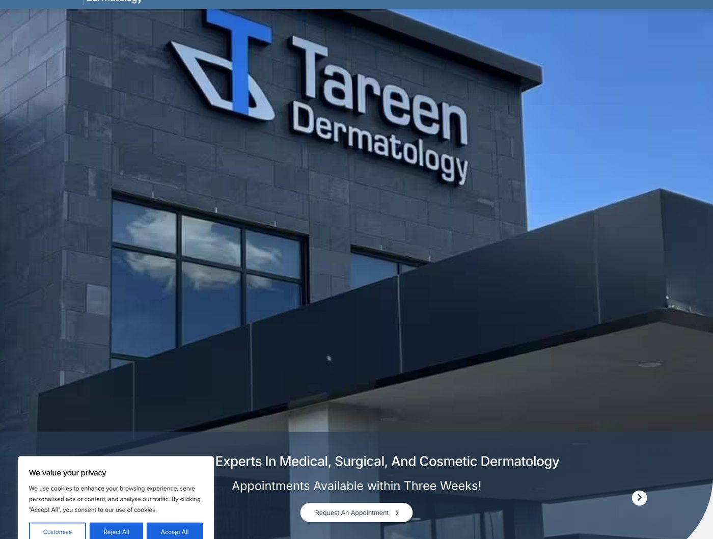 Tareen Dermatology homepage hero over a photo of its building reading Experts In Medical, Surgical, And Cosmetic Dermatology, Appointments Available within Three Weeks